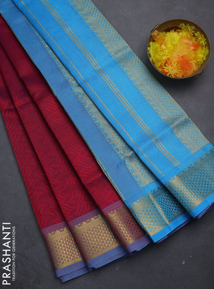 Silk cotton saree dual shade of maroon and blue with allover self emboss jacquard and zari woven border