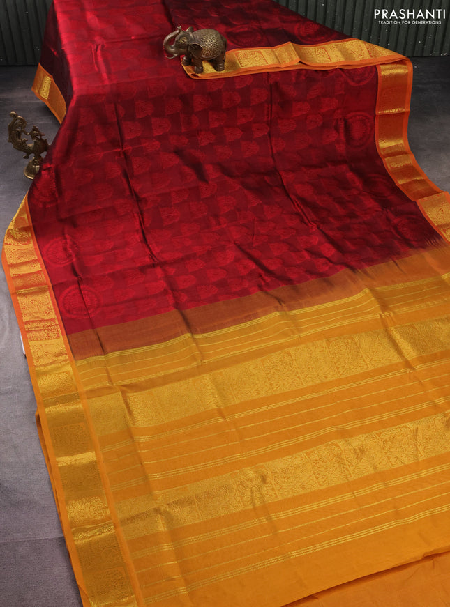Silk cotton saree maroon and mustard yellow with allover self emboss jacquard and zari woven border