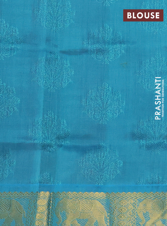 Silk cotton saree maroon and teal blue with allover self emboss jacquard and elephant zari woven border