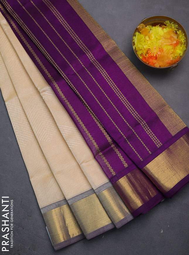 Silk cotton saree sandal and purple with allover self emboss jacquard and zari woven border
