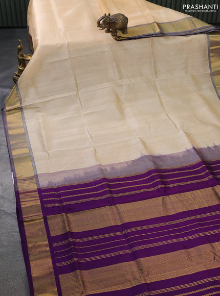 Silk cotton saree sandal and purple with allover self emboss jacquard and zari woven border