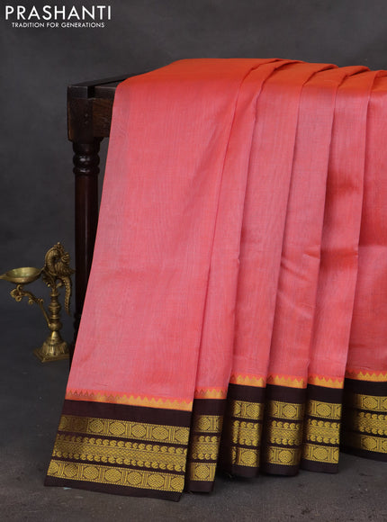 Kuppadam silk cotton saree dual shade of pinkish orange and deep coffee brown with plain body and zari woven border