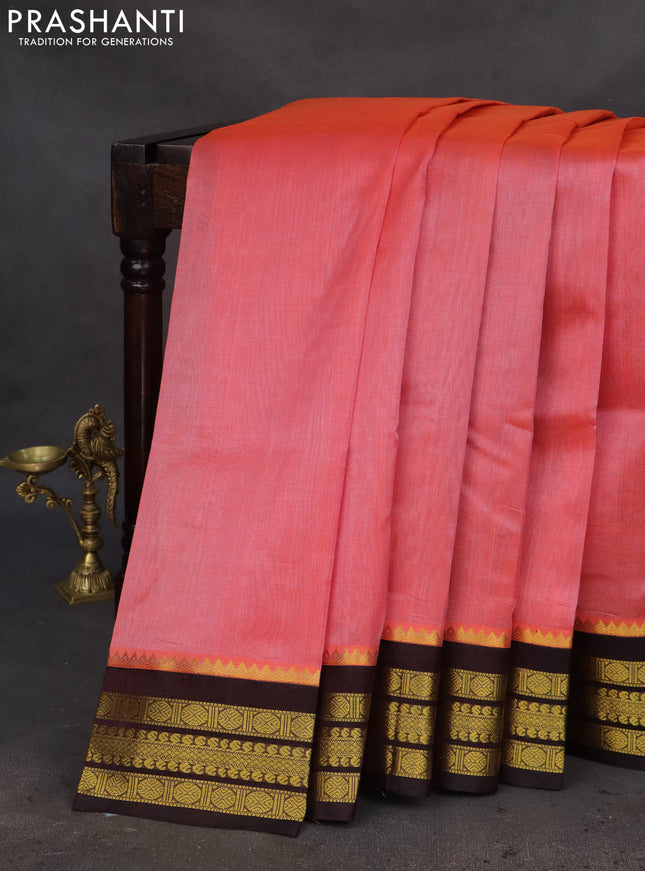 Kuppadam silk cotton saree dual shade of pinkish orange and deep coffee brown with plain body and zari woven border