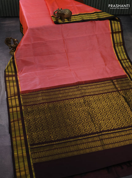 Kuppadam silk cotton saree dual shade of pinkish orange and deep coffee brown with plain body and zari woven border