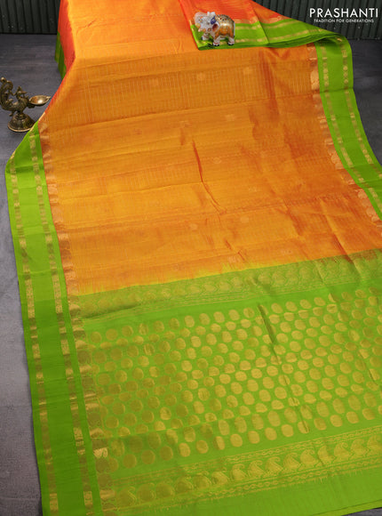 Kuppadam silk cotton saree orange and fluorescent green with allover zari checks & rudhraksha annam buttas and paisley zari woven border