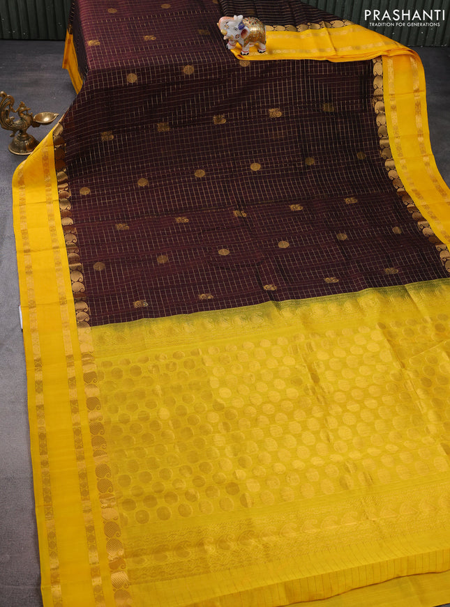Kuppadam silk cotton saree brown and mango yellow with allover zari checks & rudhraksha annam buttas and paisley zari woven border