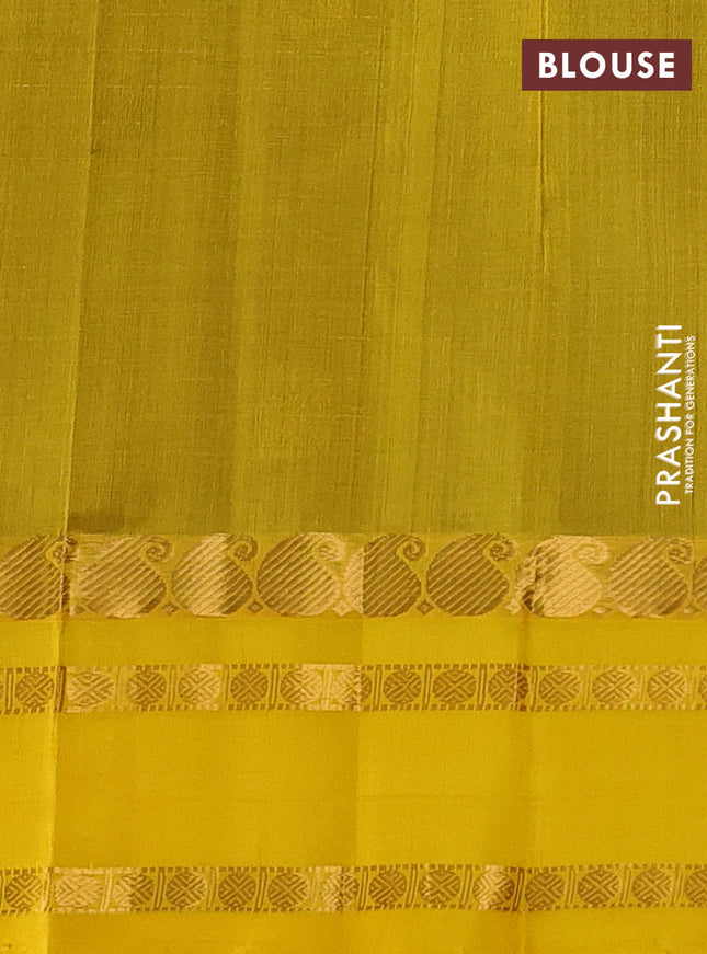 Kuppadam silk cotton saree brown and mango yellow with allover zari checks & rudhraksha annam buttas and paisley zari woven border