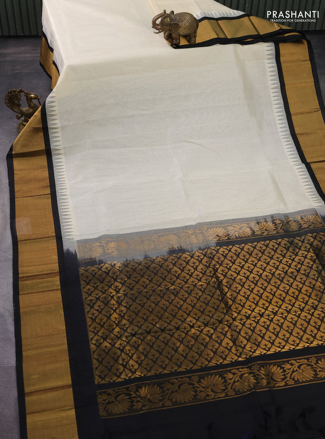 Kuppadam silk cotton saree cream and black with plain body and temple design zari woven border