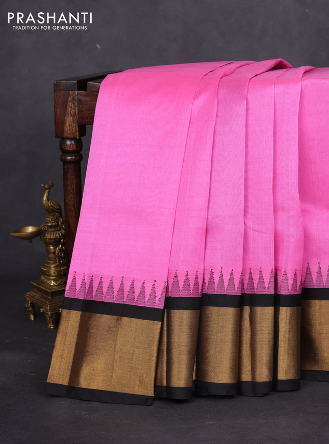 Kuppadam silk cotton saree light pink and black with plain body and temple design zari woven border
