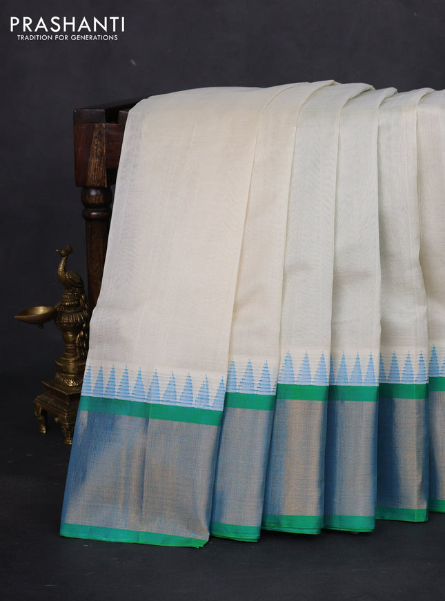 Kuppadam silk cotton saree off white and teal bluish green with plain body and temple design zari woven border