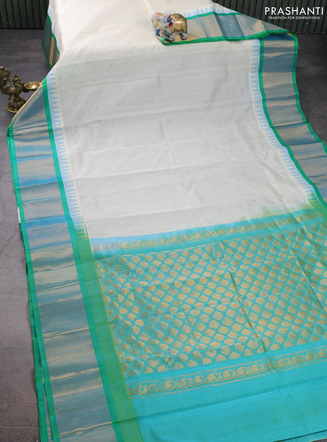 Kuppadam silk cotton saree off white and teal bluish green with plain body and temple design zari woven border