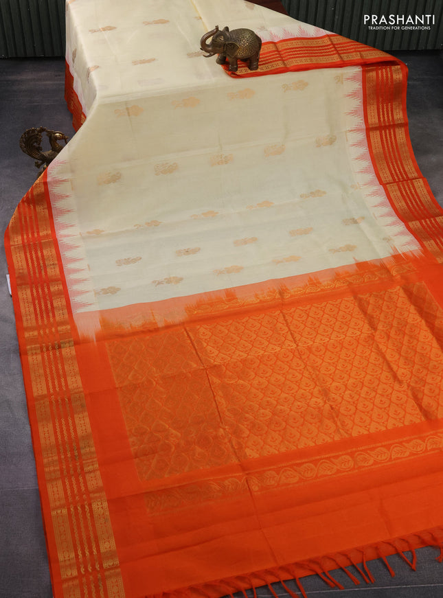 Kuppadam silk cotton saree cream and orange with zari woven buttas and temple design zari woven border