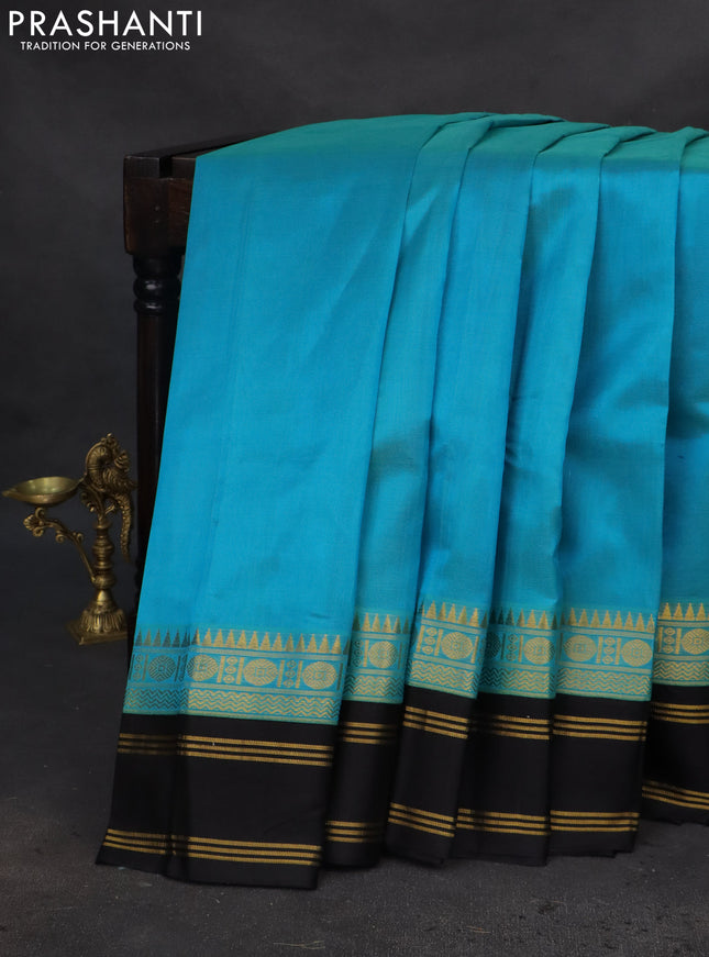 Kuppadam silk cotton saree teal blue and black with plain body and rettapet zari woven border