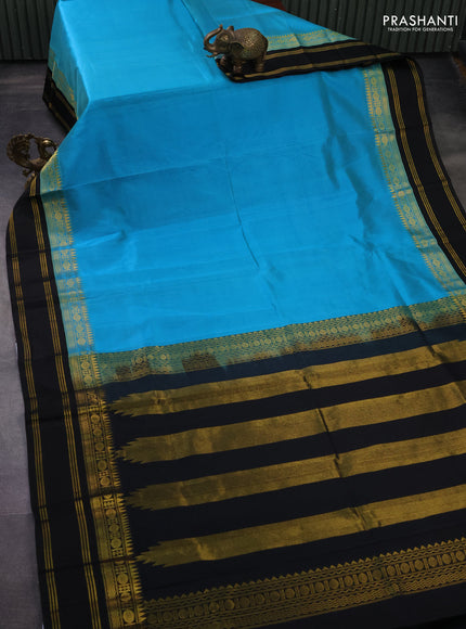 Kuppadam silk cotton saree teal blue and black with plain body and rettapet zari woven border