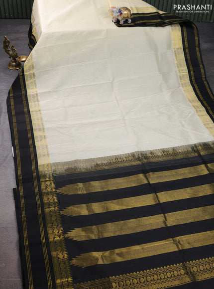 Kuppadam silk cotton saree cream and black with plain body and rettapet zari woven border
