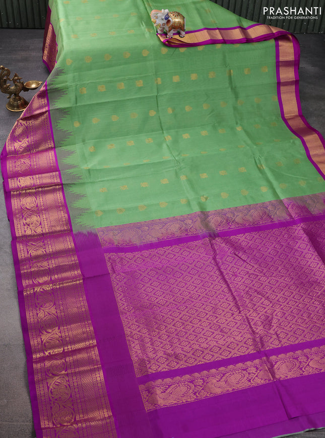 Kuppadam silk cotton saree pastel green and purple with zari woven buttas and temple design long zari woven border