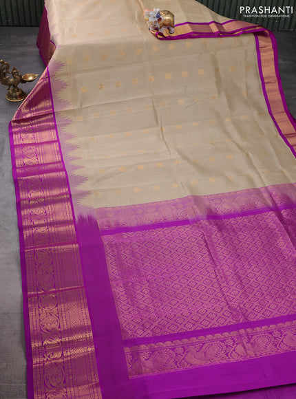 Kuppadam silk cotton saree beige and purple with zari woven buttas and temple design long zari woven border