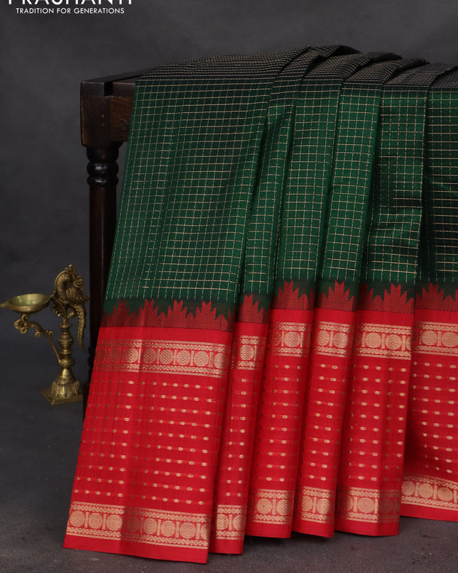 Kuppadam silk cotton saree dark green and red with allover small zari checks and temple design long zari woven butta border