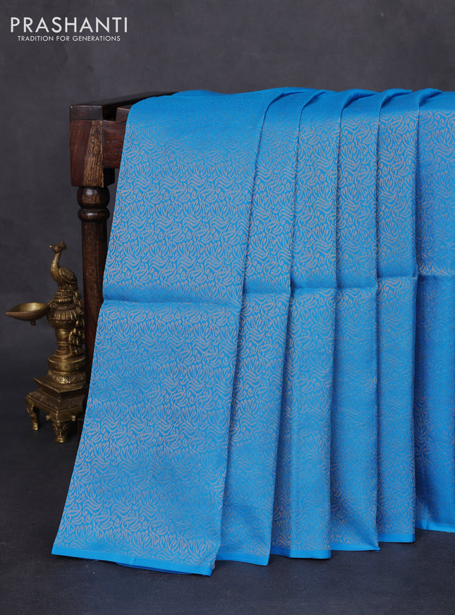 Kanchipuram soft silk saree cs blue and dual shade of pinkish orange with half & half style in borderless style