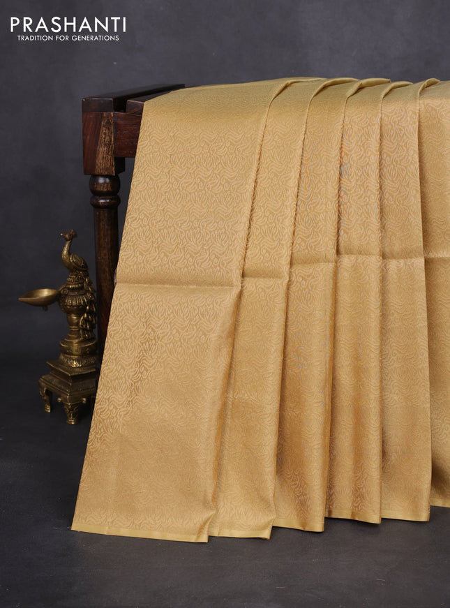 Kanchipuram soft silk saree sandal and dual shade of pinkish orange with half & half style in borderless style