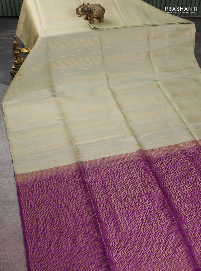 Kanchipuram soft silk saree elaichi green and purple with allover zari weaves & buttas in borderless style