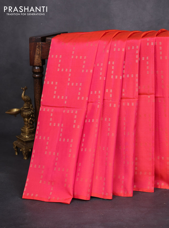 Kanchipuram soft silk saree dual shade of pinkish orange and teal blue with allover zig zag zari weaves in borderless style