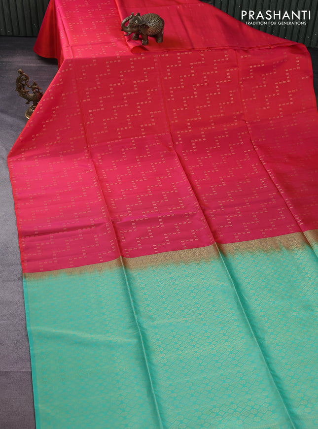 Kanchipuram soft silk saree dual shade of pinkish orange and teal blue with allover zig zag zari weaves in borderless style