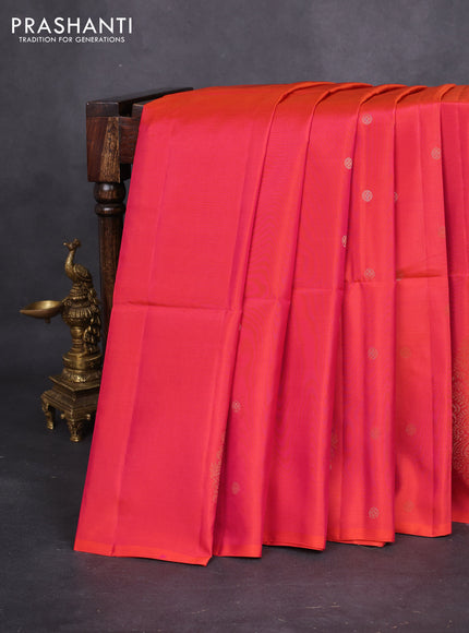 Kanchipuram soft silk saree dual shade of pinkish orange with zari woven buttas and long zari woven paisley butta border