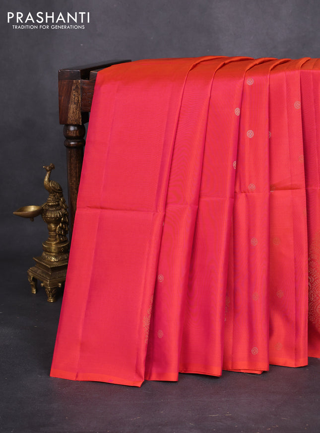 Kanchipuram soft silk saree dual shade of pinkish orange with zari woven buttas and long zari woven paisley butta border