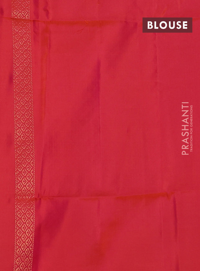 Kanchipuram soft silk saree dual shade of pinkish orange with zari woven buttas and long zari woven paisley butta border