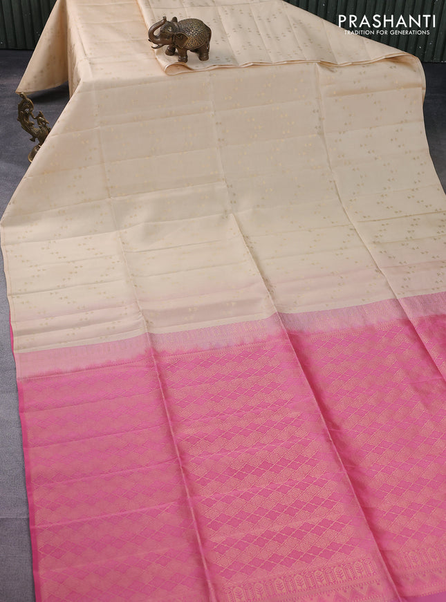 Kanchipuram soft silk saree cream and candy pink with allover zari woven geometric buttas in borderless style