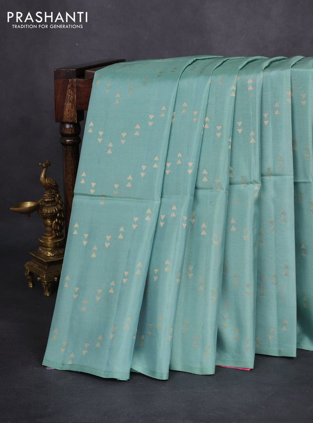 Kanchipuram soft silk saree pastel blue and candy pink with allover zari woven geometric buttas in borderless style