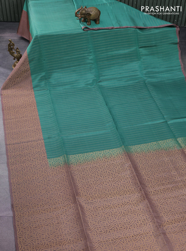 Kanchipuram soft silk saree teal green shade and pastel brown with allover zari stripe pattern and long rich zari woven border