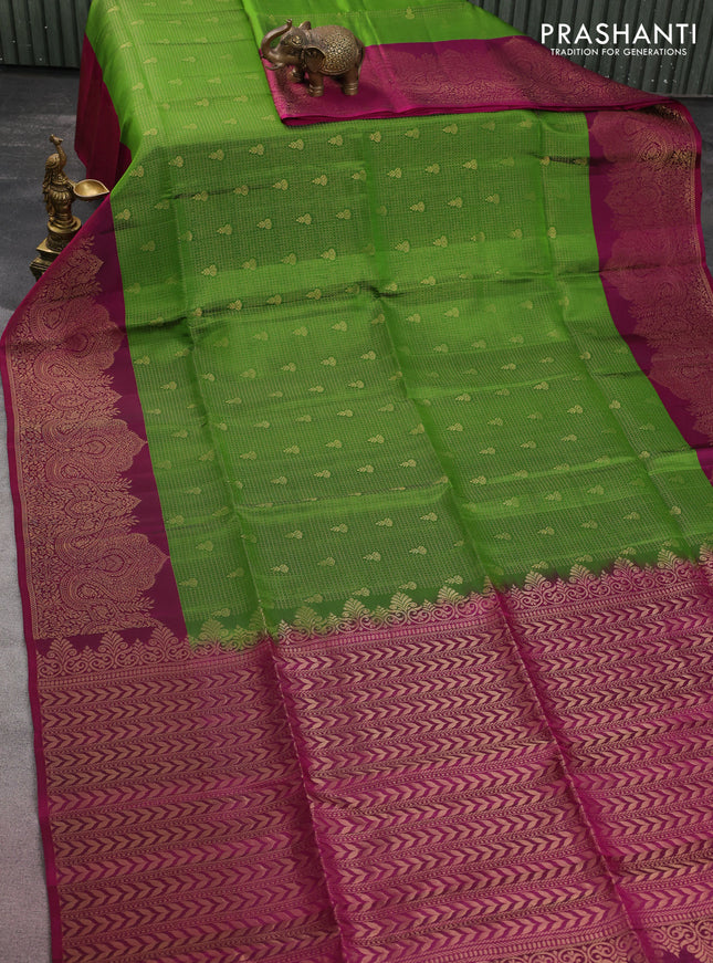 Kanchipuram soft silk saree green and dark magenta pink with allover zari woven brocdae weaves and long zari woven border