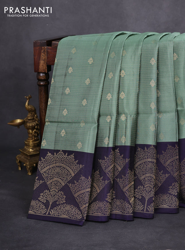 Kanchipuram soft silk saree pastel green and navy blue with allover zari woven brocade weaves and long zari woven border