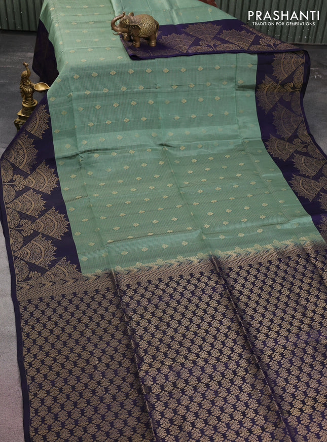 Kanchipuram soft silk saree pastel green and navy blue with allover zari woven brocade weaves and long zari woven border
