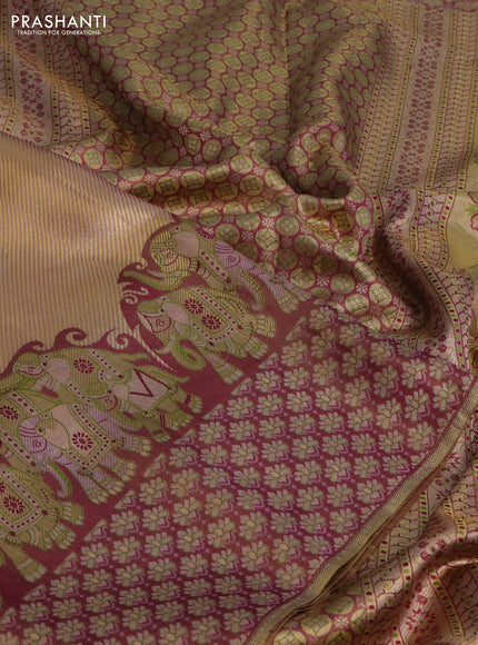 Pure kanchipuram tissue silk saree dual shade of pastel pink and wine shade with allover zari weaves and rich elephant design mina border