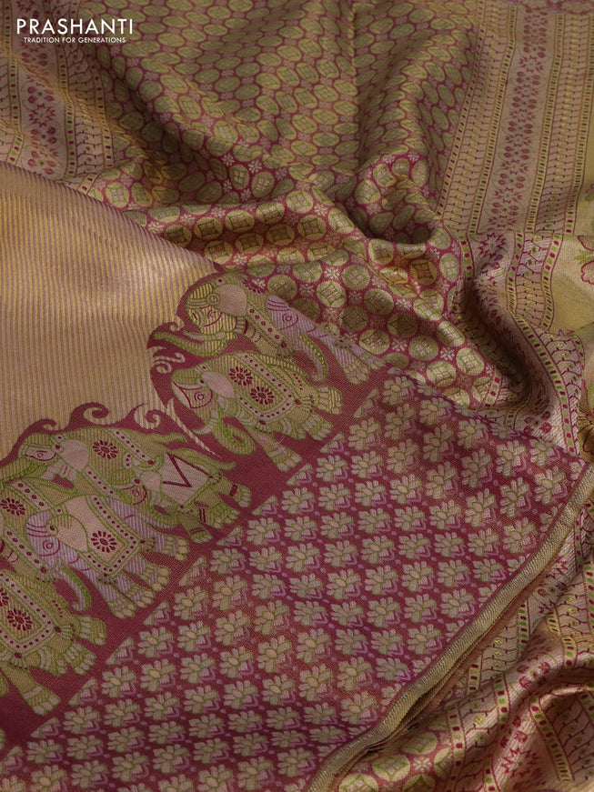 Pure kanchipuram tissue silk saree dual shade of pastel pink and wine shade with allover zari weaves and rich elephant design mina border