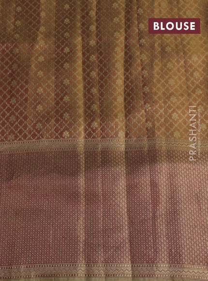 Pure kanchipuram tissue silk saree dual shade of pastel pink and wine shade with allover zari weaves and rich elephant design mina border