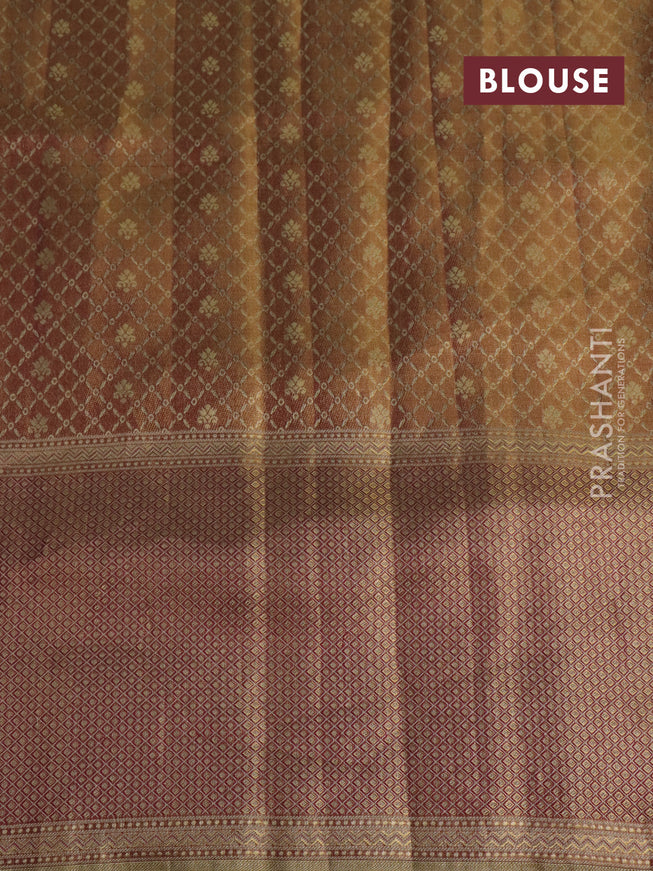 Pure kanchipuram tissue silk saree dual shade of pastel pink and wine shade with allover zari weaves and rich elephant design mina border
