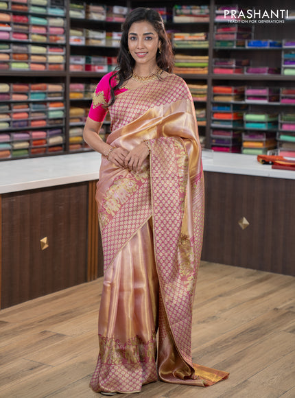 Pure kanchipuram tissue silk saree dual shade of pastel pink and wine shade with allover zari weaves and rich elephant design mina border