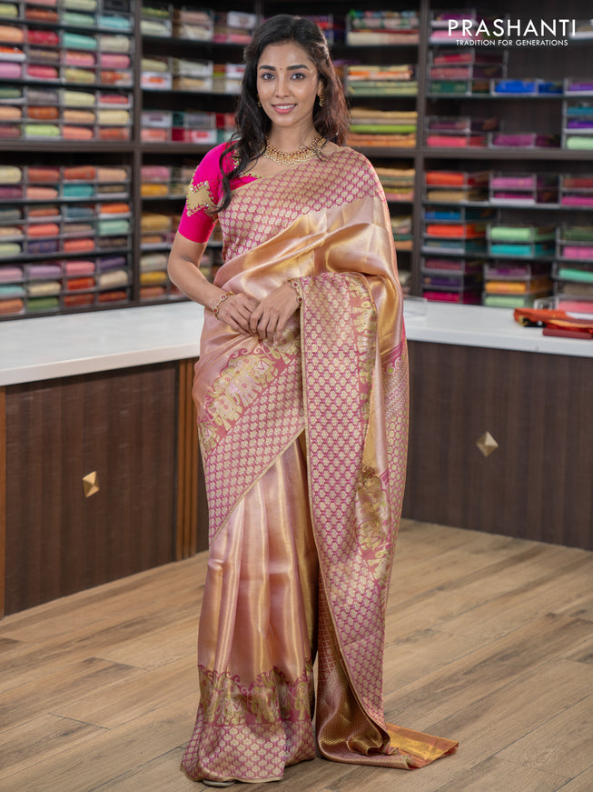 Pure kanchipuram tissue silk saree dual shade of pastel pink and wine shade with allover zari weaves and rich elephant design mina border