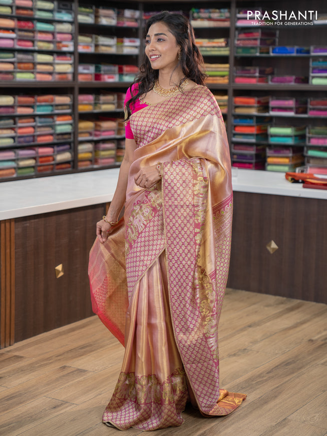 Pure kanchipuram tissue silk saree dual shade of pastel pink and wine shade with allover zari weaves and rich elephant design mina border