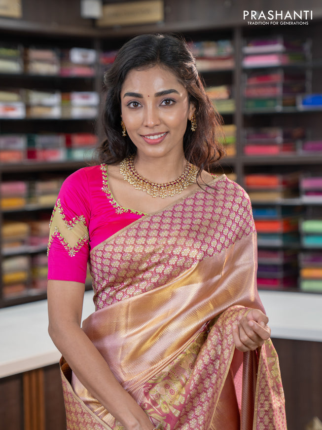 Pure kanchipuram tissue silk saree dual shade of pastel pink and wine shade with allover zari weaves and rich elephant design mina border