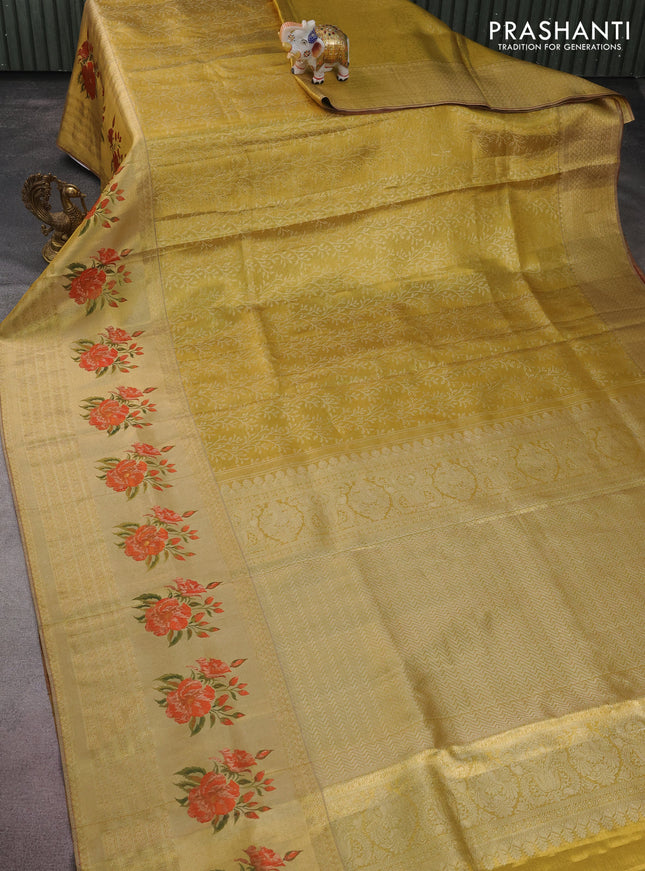 Pure kanchipuram tissue silk saree gold and red with allover zari weaves and floral design butta border