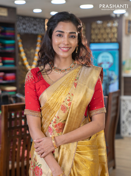 Pure kanchipuram tissue silk saree gold and red with allover zari weaves and floral design butta border