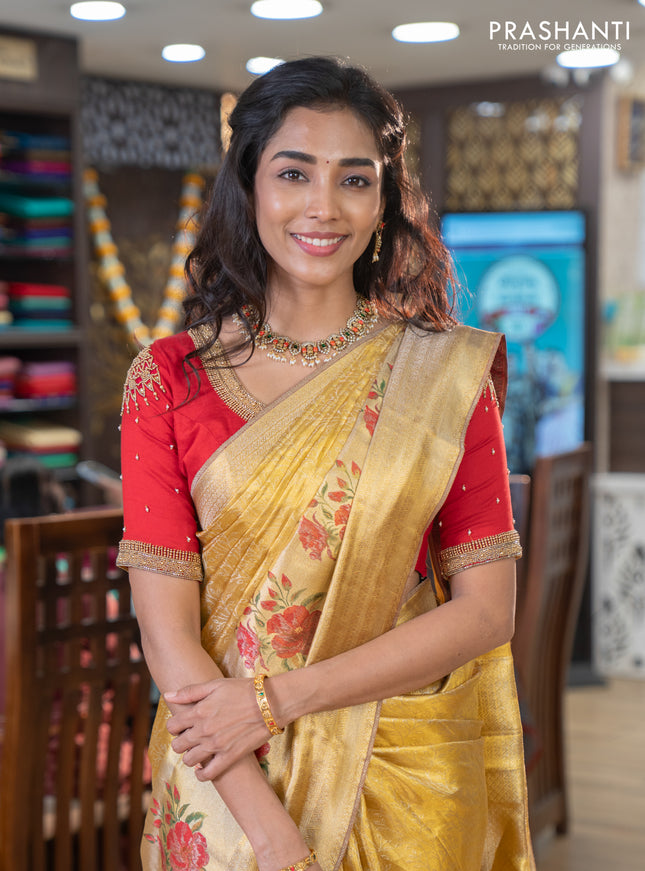 Pure kanchipuram tissue silk saree gold and red with allover zari weaves and floral design butta border