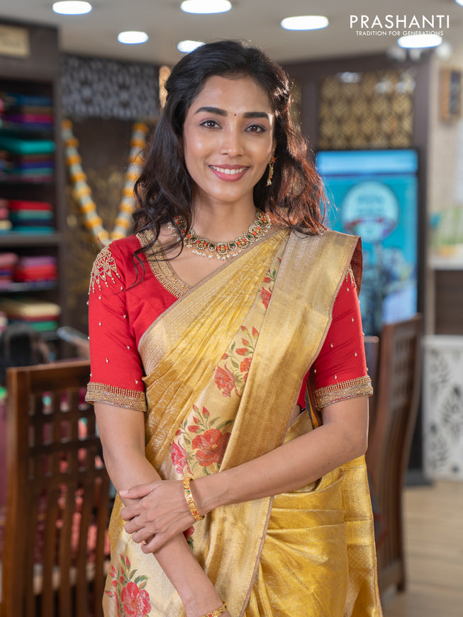 Pure kanchipuram tissue silk saree gold and red with allover zari weaves and floral design butta border
