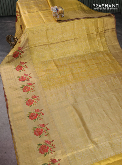 Pure kanchipuram tissue silk saree gold and maroon with allover zari weaves and floral design butta border