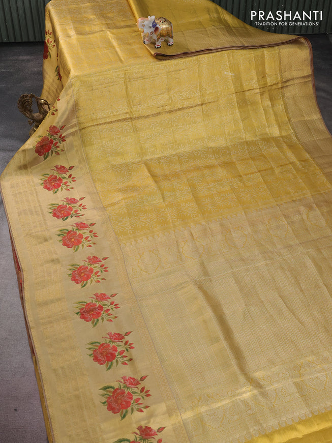 Pure kanchipuram tissue silk saree gold and maroon with allover zari weaves and floral design butta border
